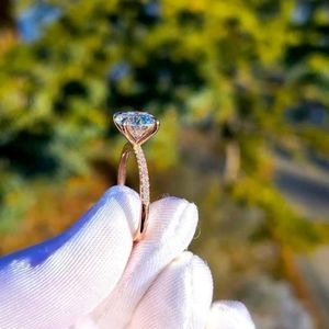 Solid 14k rose gold 2ct moissanite ring with side diamond